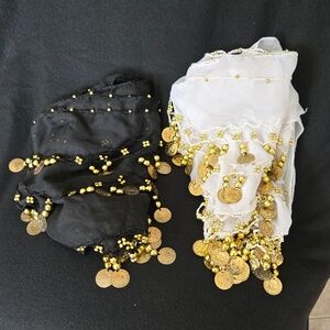 Two belly dance hip wraps, one black and one white.